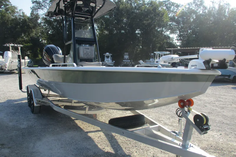 Slide: The Image of 2026 Avid 23 Fusion boat on trailer, parked outdoors, featuring sleek design and modern equipment. - 3