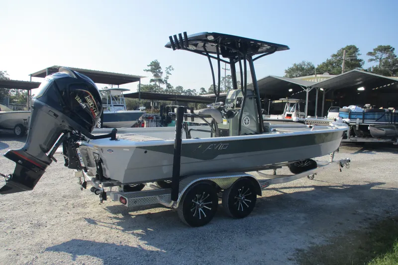 Slide: The Image of 2026 Avid 23 Fusion boat on trailer with Yamaha outboard motor in a marina setting. - 4