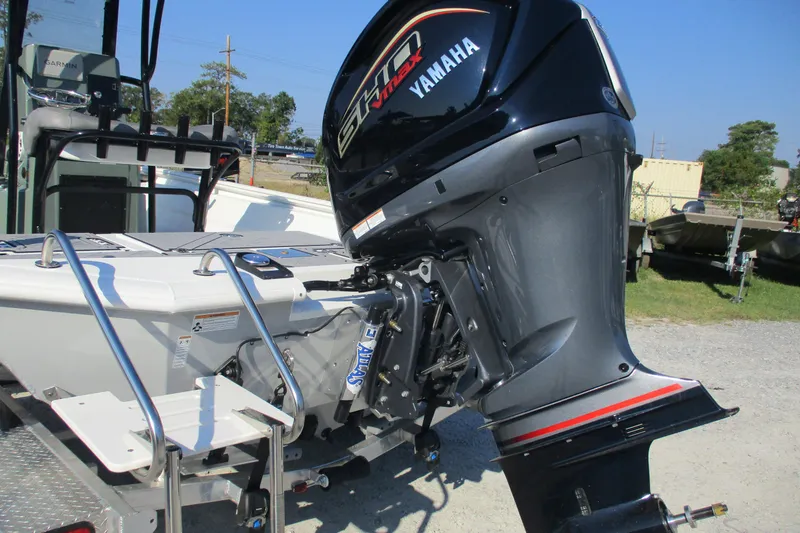 Slide: The Image of Avid 23 Fusion 2026 boat with Yamaha outboard motor, parked outdoors. - 7