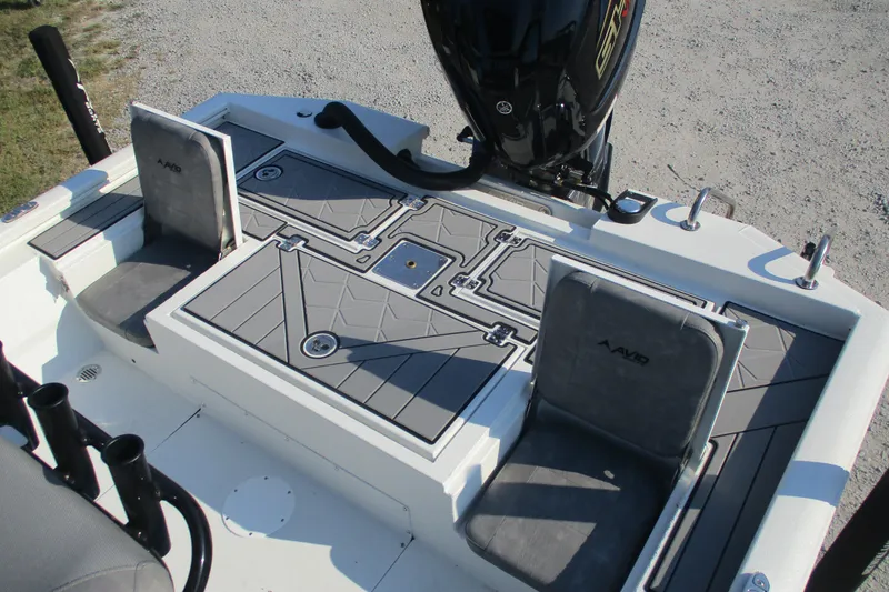 Slide: The Image of 2026 Avid 23 Fusion boat interior with seating and storage compartments. - 8