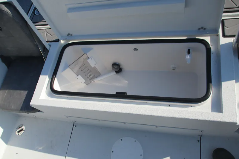 Slide: The Image of Open storage compartment in 2026 Avid 23 Fusion boat interior. - 9
