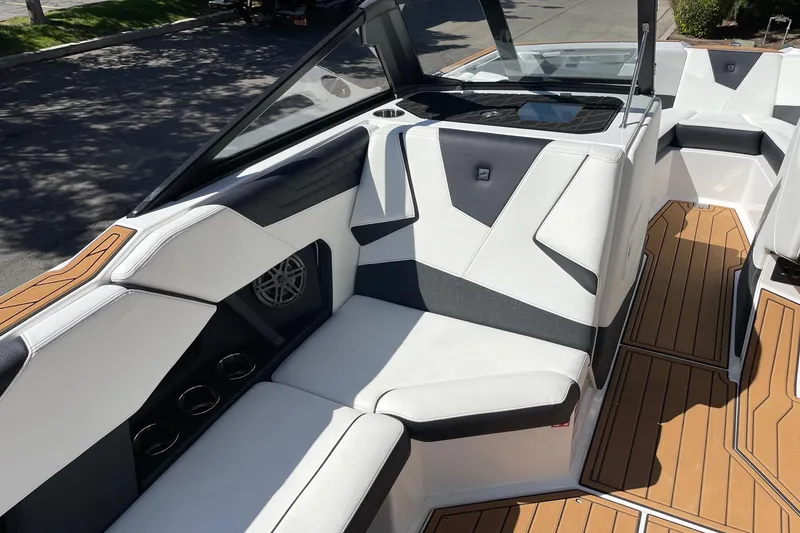 Slide: The Image of 2026 Nautique Super Air Nautique S23 interior with sleek seating and modern design. - 10