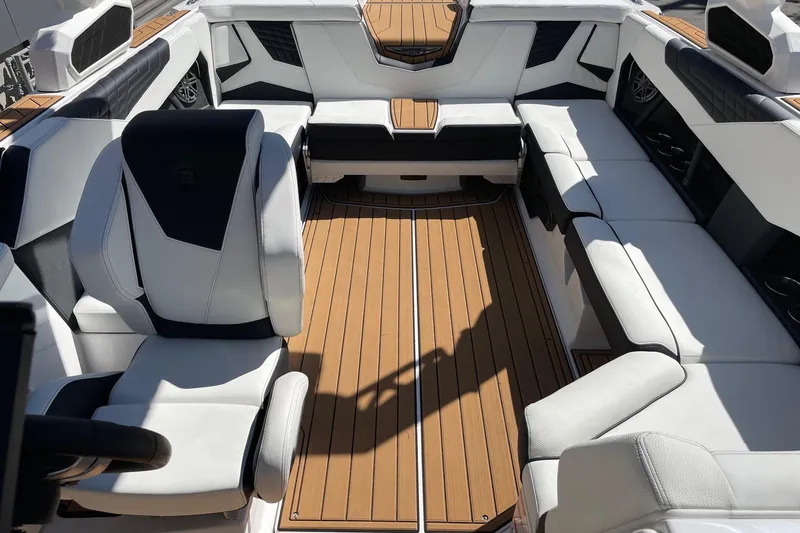 Slide: The Image of 2026 Nautique Super Air Nautique S23 interior with luxurious seating and sleek design. - 12