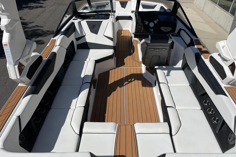Slide: The Image of 2026 Nautique Super Air Nautique S23 interior with luxurious seating and sleek design. - 5