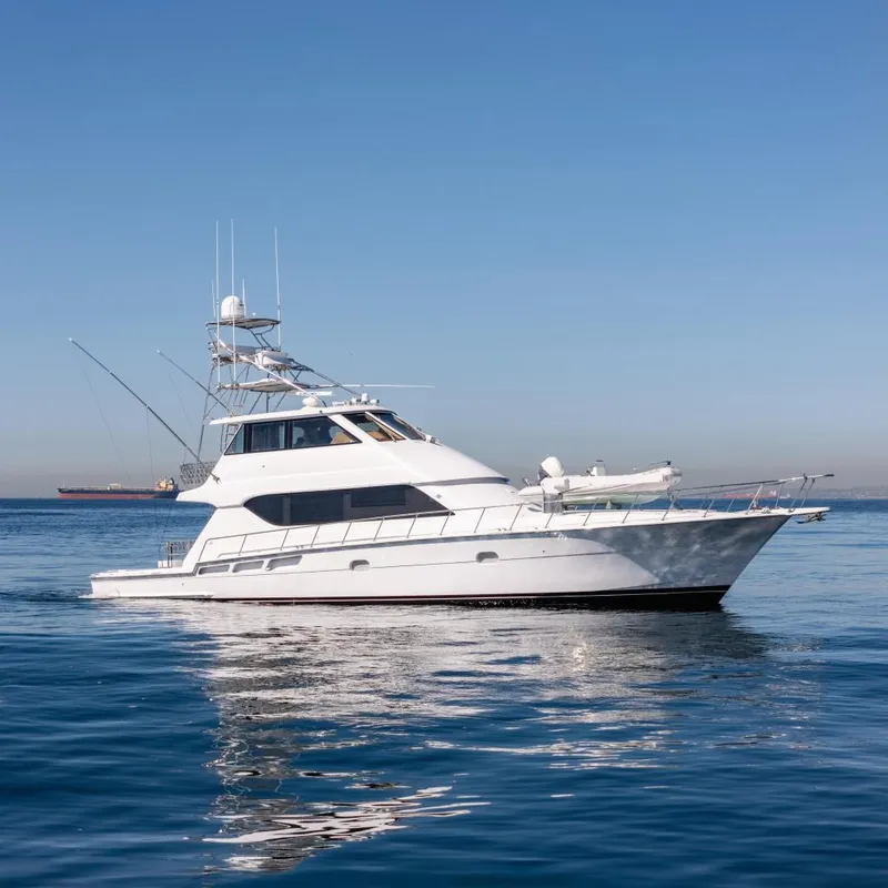 The Image of Hatteras 70 Convertible yacht, 2000 model, cruising on calm blue waters. - 0