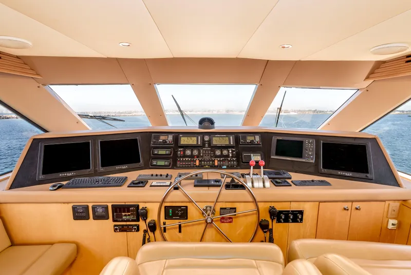 Slide: The Image of Cockpit of 2000 Hatteras 70 Convertible yacht with modern navigation equipment and panoramic view. - 20