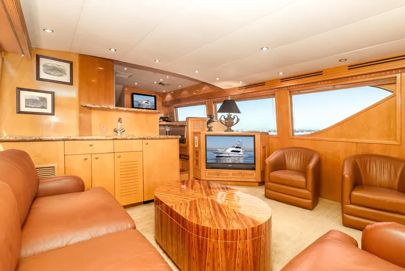 Slide: The Image of Luxurious interior of 2000 Hatteras 70 Convertible yacht with leather seating and wood finishes. - 27