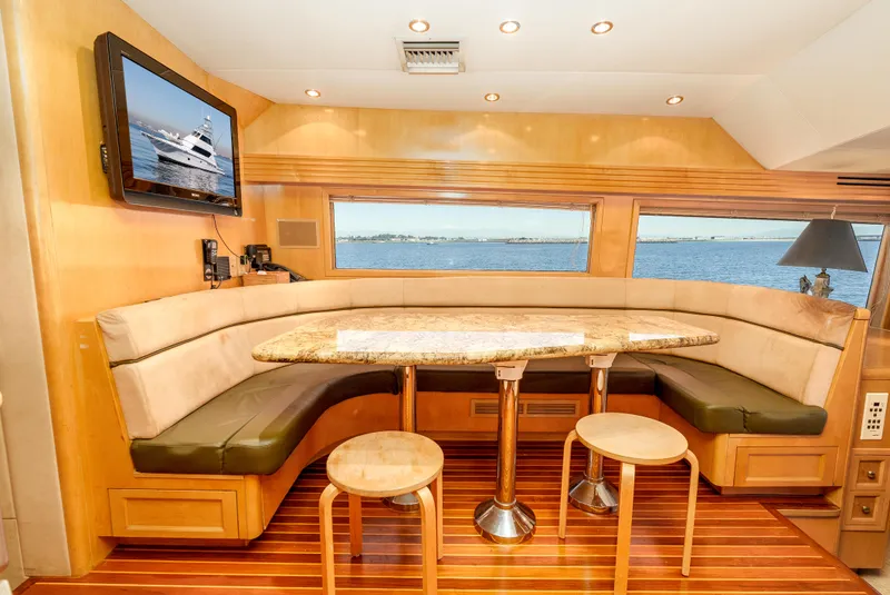 Slide: The Image of Luxurious interior of 2000 Hatteras 70 Convertible yacht with elegant seating and ocean view. - 30