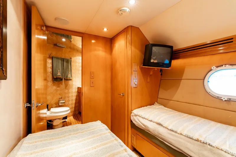 Slide: The Image of Luxurious cabin interior of 2000 Hatteras 70 Convertible yacht with ensuite bathroom. - 39