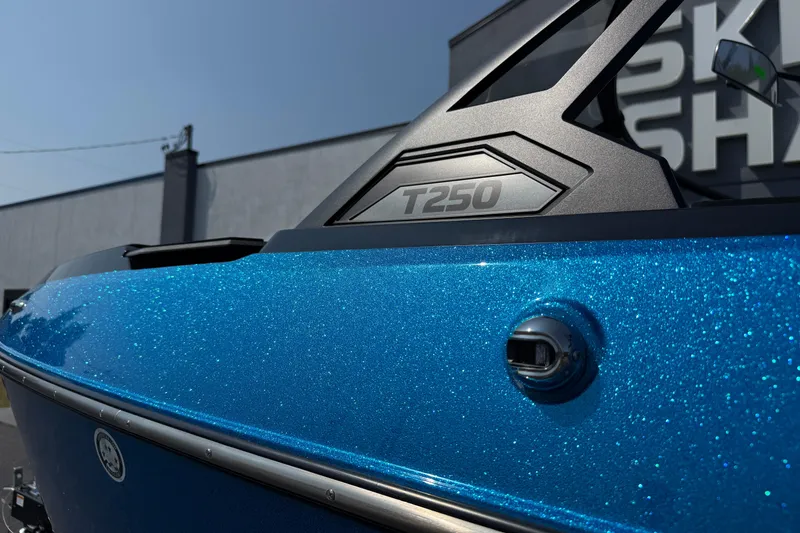 Slide: The Image of 2026 Axis T250 boat with sparkling blue finish and sleek design. - 10