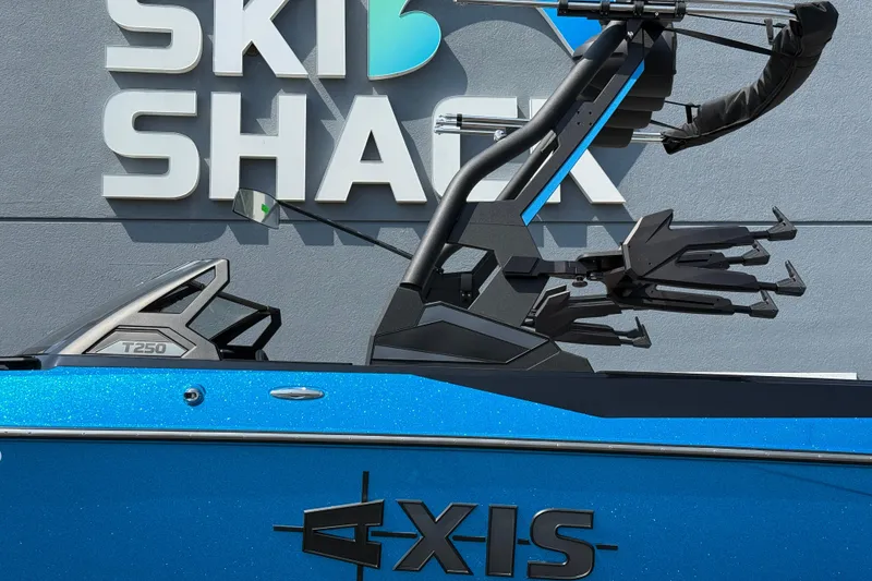 Slide: The Image of 2026 Axis T250 boat in blue, displayed at Ski Shack. - 11