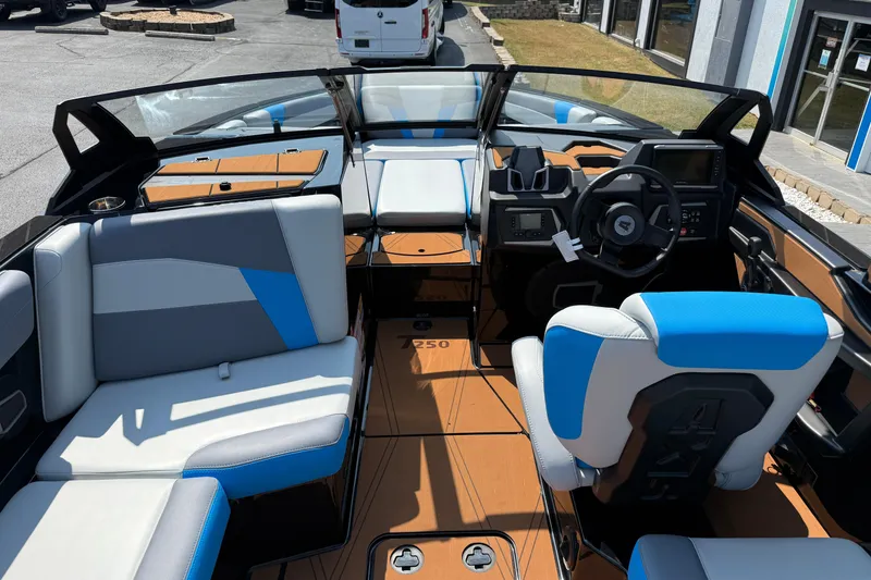 Slide: The Image of 2026 Axis T250 boat interior with modern dashboard and stylish seating. - 14
