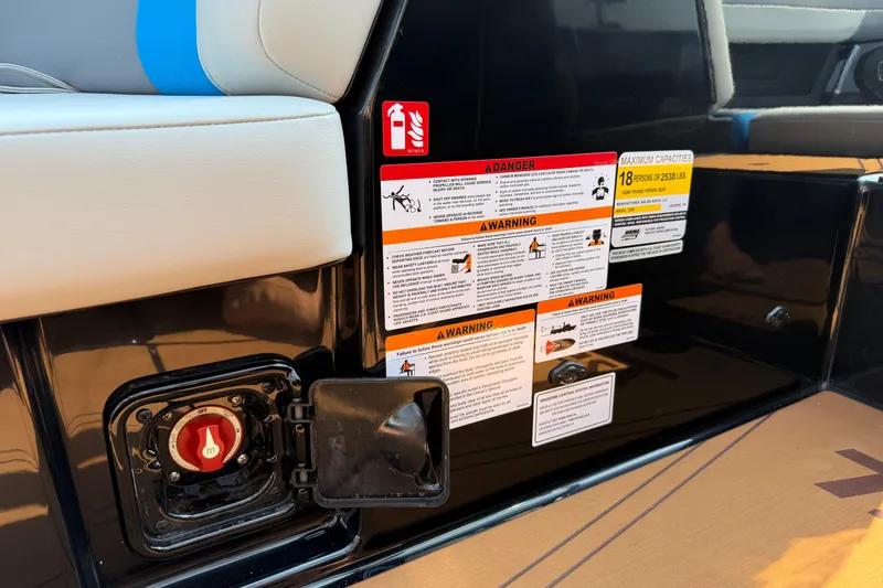 Slide: The Image of 2026 Axis T250 boat safety and warning labels near seating area. - 17