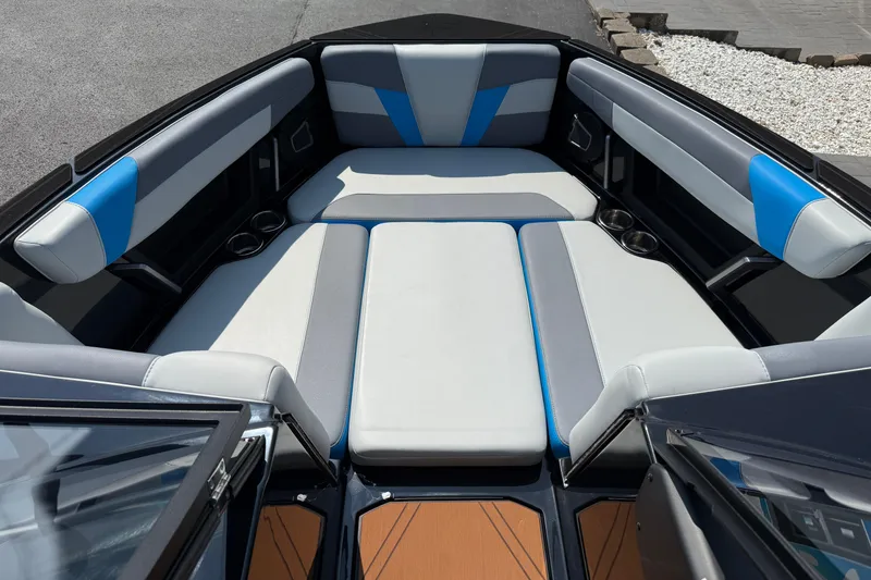 Slide: The Image of 2026 Axis T250 boat interior with gray and blue cushioned seating. - 18