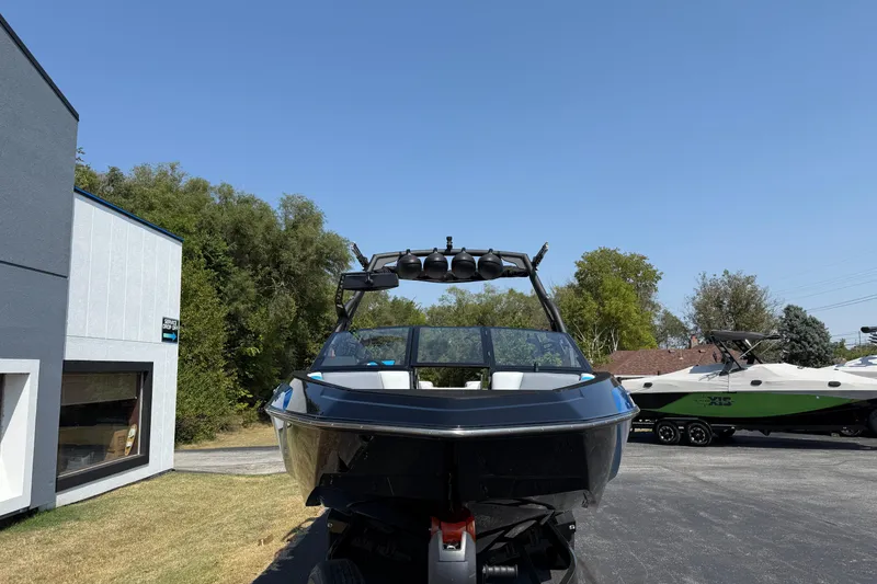 Slide: The Image of 2026 Axis T250 boat parked outdoors on a sunny day. - 2