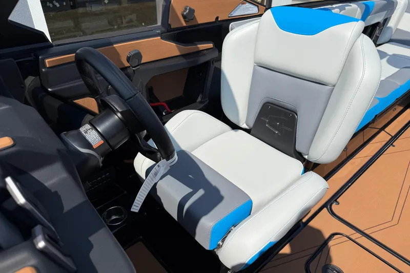 Slide: The Image of 2026 Axis T250 boat interior with modern steering wheel and comfortable seating. - 23