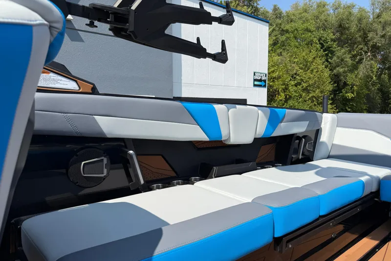 Slide: The Image of 2026 Axis T250 boat interior with blue and gray seating, showcasing modern design. - 24