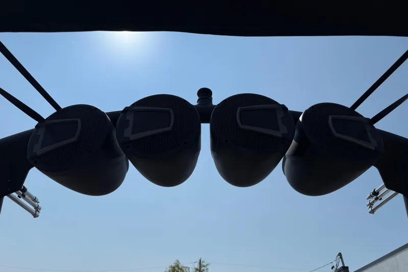 Slide: The Image of Four speakers mounted on a 2026 Axis T250 boat against a clear blue sky. - 29