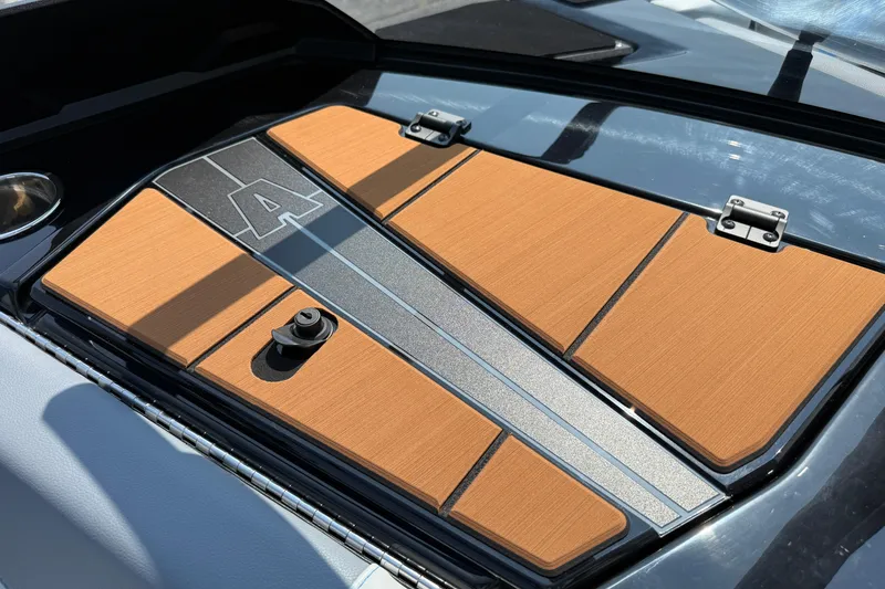 Slide: The Image of 2026 Axis T250 boat engine cover with sleek design and orange accents. - 31