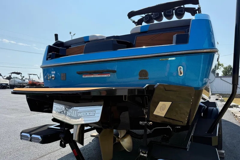 Slide: The Image of 2026 Axis T250 boat rear view with Power Wedge III, blue exterior. - 6