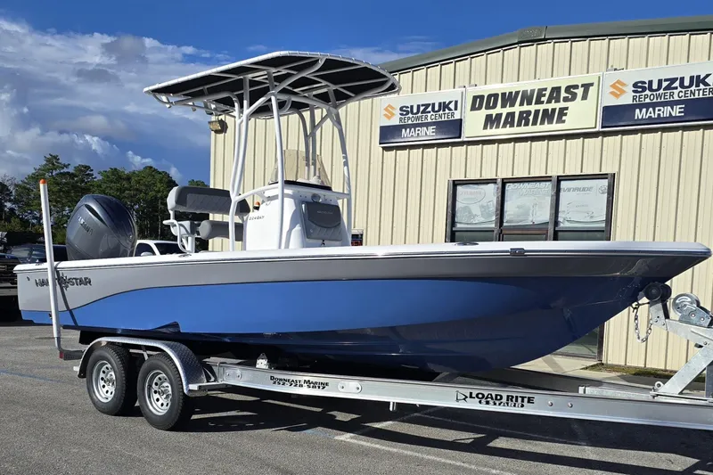 The Image of 2026 NauticStar 224 Bay boat on trailer at Downeast Marine dealership. - 1