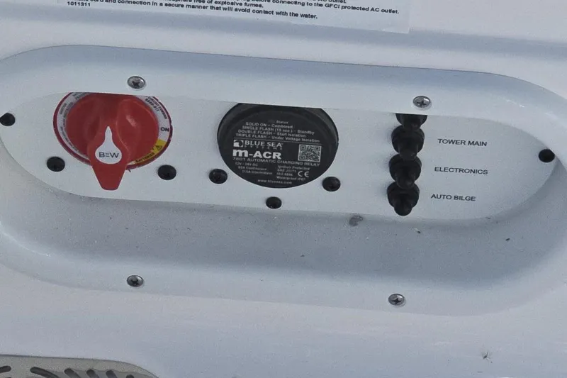 Slide: The Image of Control panel of a 2026 NauticStar 224 Bay boat with switches and labels. - 10