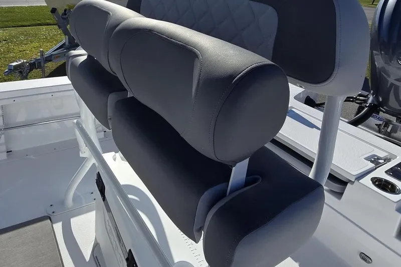 Slide: The Image of 2026 NauticStar 224 Bay boat seat with cushioned backrest and sleek design. - 13