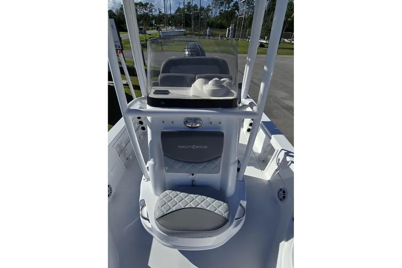 Slide: The Image of 2026 NauticStar 224 Bay boat interior with console and seating, featuring modern design elements. - 17