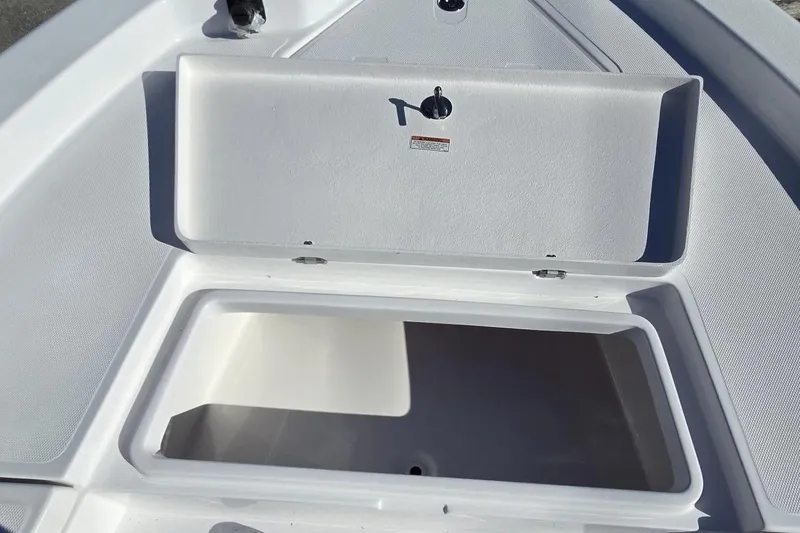 Slide: The Image of Open storage compartment on 2026 NauticStar 224 Bay boat. - 22