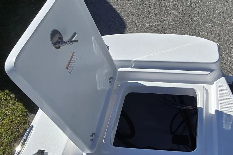 Slide: The Image of Open storage compartment on 2026 NauticStar 224 Bay boat. - 8