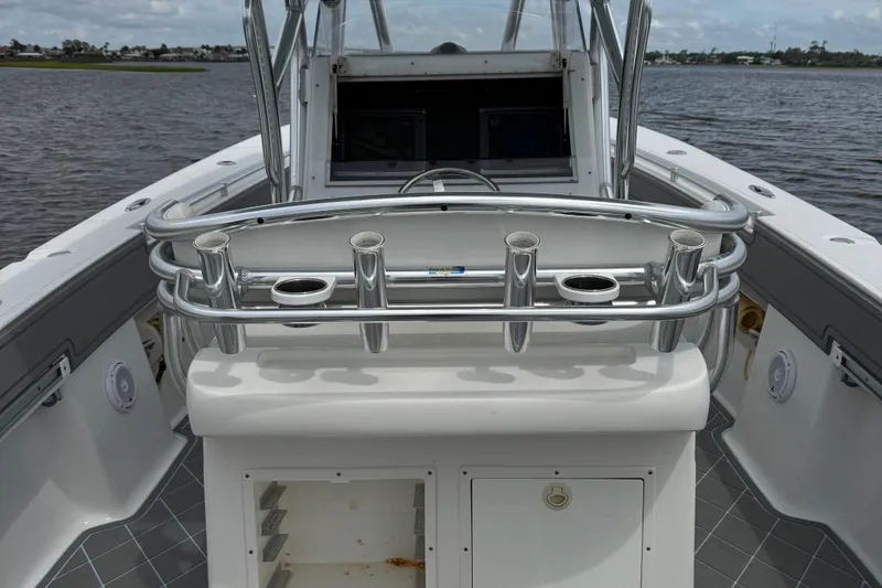 Slide: The Image of 2013 SeaHunter 33 Tournament boat with rod holders and open storage on deck. - 31