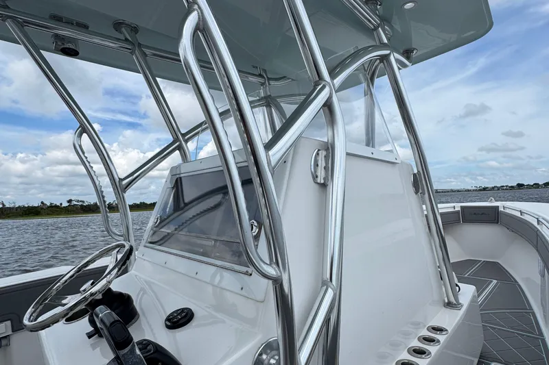 Slide: The Image of 2013 SeaHunter 33 Tournament boat with sleek console and stainless steel railings. - 33