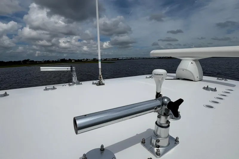 Slide: The Image of 2013 SeaHunter 33 Tournament boat deck with Garmin equipment under cloudy sky. - 37