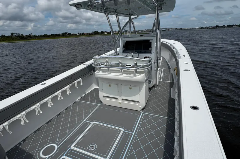 Slide: The Image of 2013 SeaHunter 33 Tournament boat interior with sleek design and spacious deck. - 38