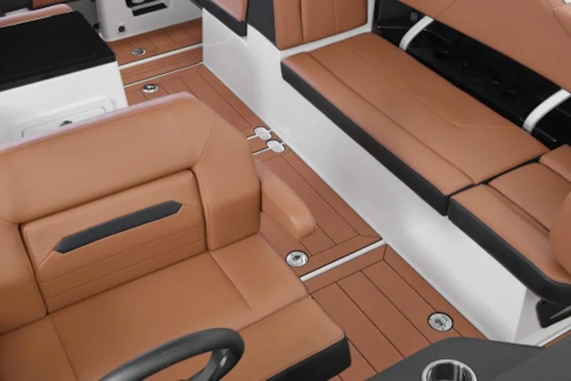 Slide: The Image of 2026 Yamaha Boats 295SD interior with brown leather seating and sleek design. - 2