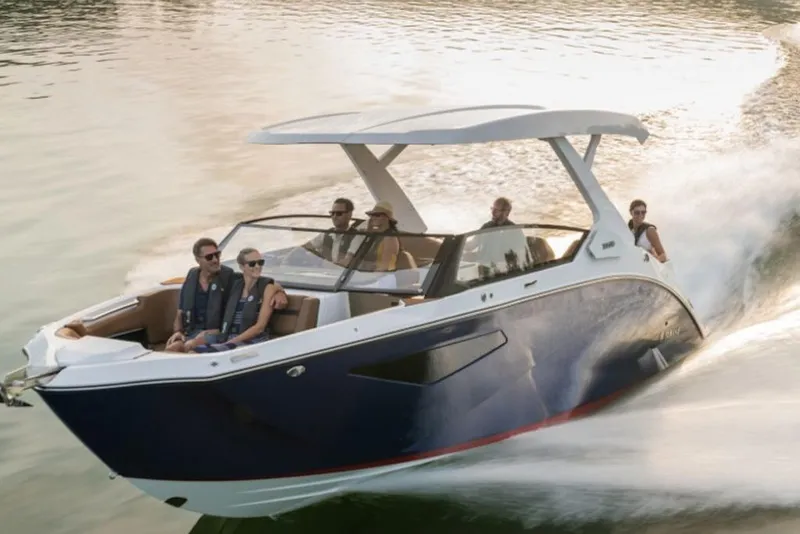 Slide: The Image of 2026 Yamaha Boats 295SD cruising on water with passengers enjoying the ride. - 3