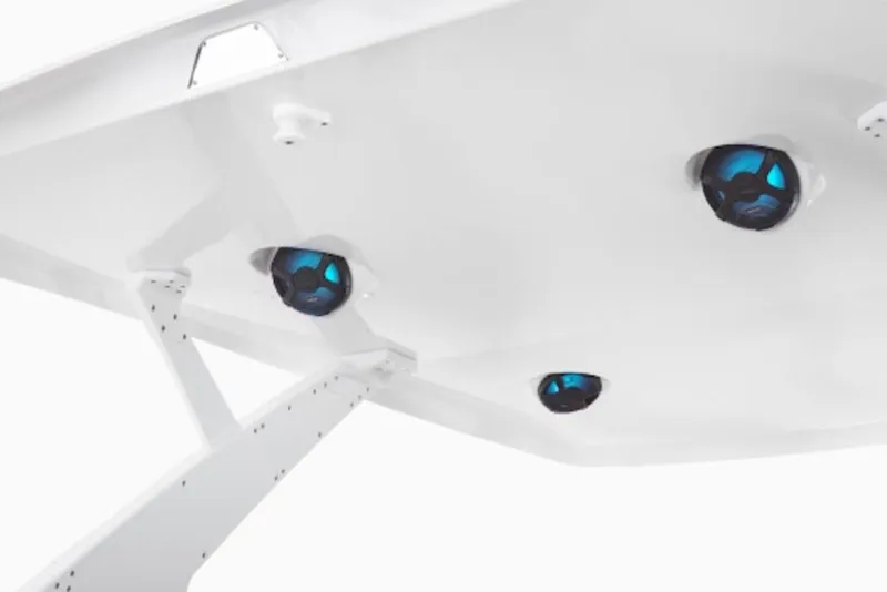 Slide: The Image of 2026 Yamaha Boats 295SD with sleek white canopy and integrated blue speakers. - 4