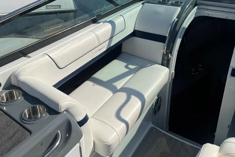 Slide: The Image of 2015 Formula 290 Sun Sport boat interior with white cushioned seating. - 6