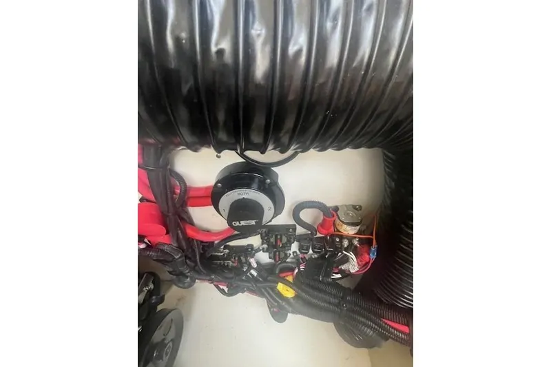 Slide: The Image of Engine compartment of 2019 Sea Ray SDX 270 with wiring and components visible. - 5