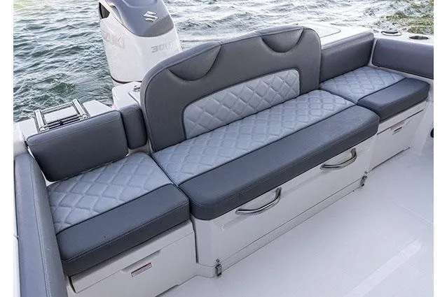 Slide: The Image of 2026 NauticStar 242L Offshore boat seat with integrated storage compartment. - 10