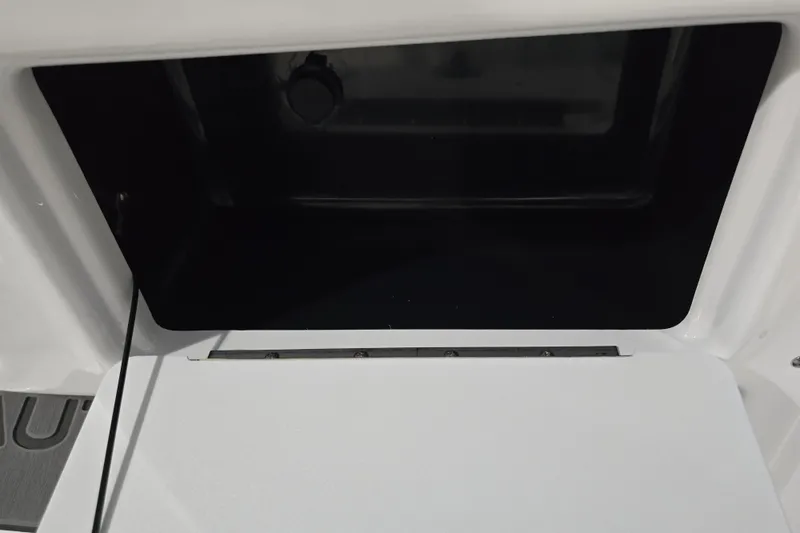 Slide: The Image of Open storage compartment on 2026 NauticStar 242L Offshore boat. - 15