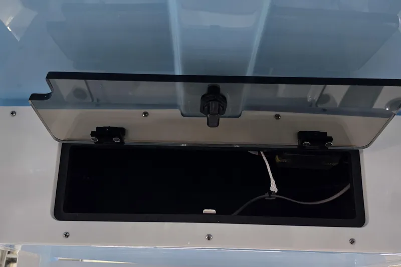 Slide: The Image of Open storage compartment on 2026 NauticStar 242L Offshore boat. - 16