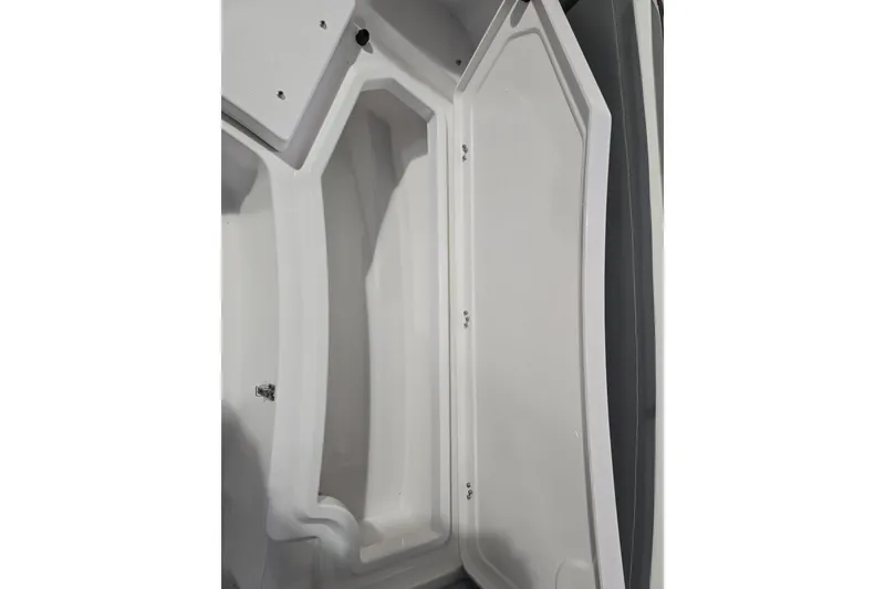 Slide: The Image of 2026 NauticStar 242L Offshore boat interior storage compartment. - 22