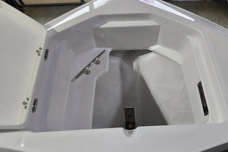 Slide: The Image of Interior view of 2026 NauticStar 242L Offshore boat compartment. - 26