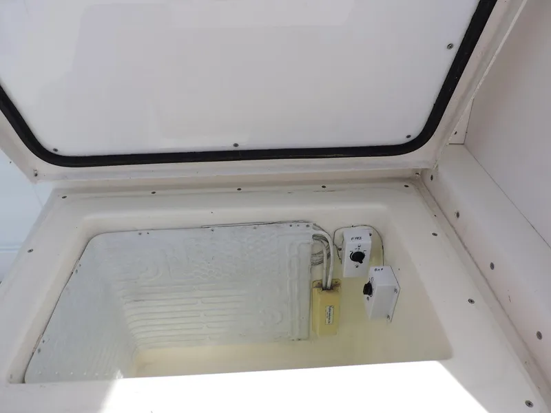 Slide: The Image of Open storage compartment on 1990 Post 44 Sport Fisherman boat. - 10