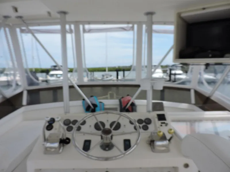 Slide: The Image of Helm of 1990 Post 44 Sport Fisherman boat with steering wheel and controls. - 16