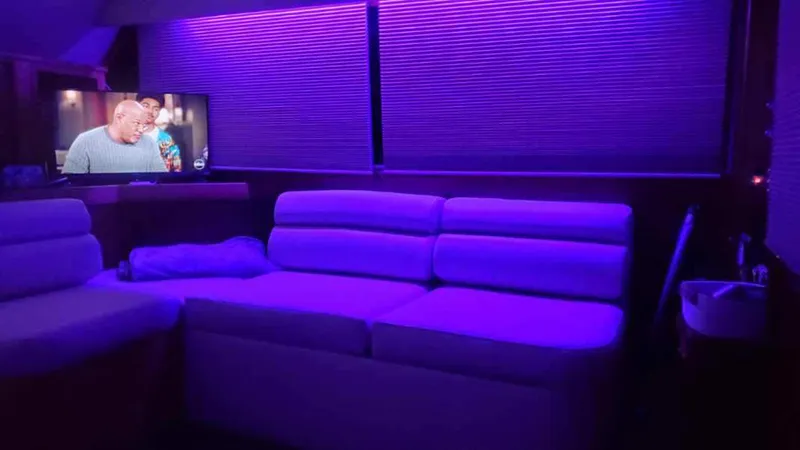 Slide: The Image of Luxurious interior of 1990 Post 44 Sport Fisherman with purple ambient lighting and TV. - 25