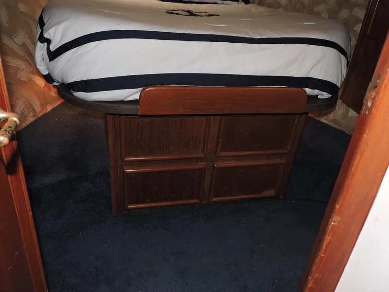 Slide: The Image of Interior cabin of 1990 Post 44 Sport Fisherman with bed and wooden storage. - 37