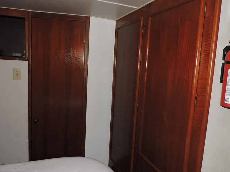 Slide: The Image of Interior of 1990 Post 44 Sport Fisherman with wooden doors and fire extinguisher. - 41
