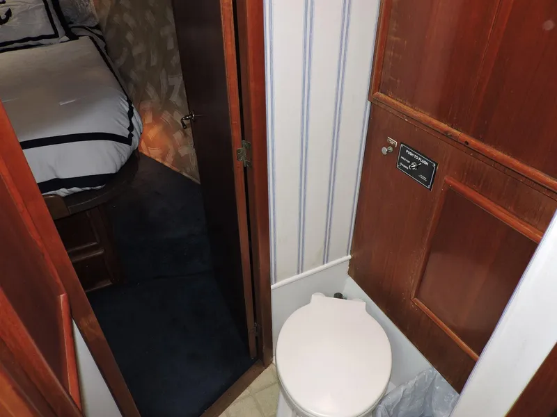 Slide: The Image of 1990 Post 44 Sport Fisherman interior with bathroom and bedroom view. - 43